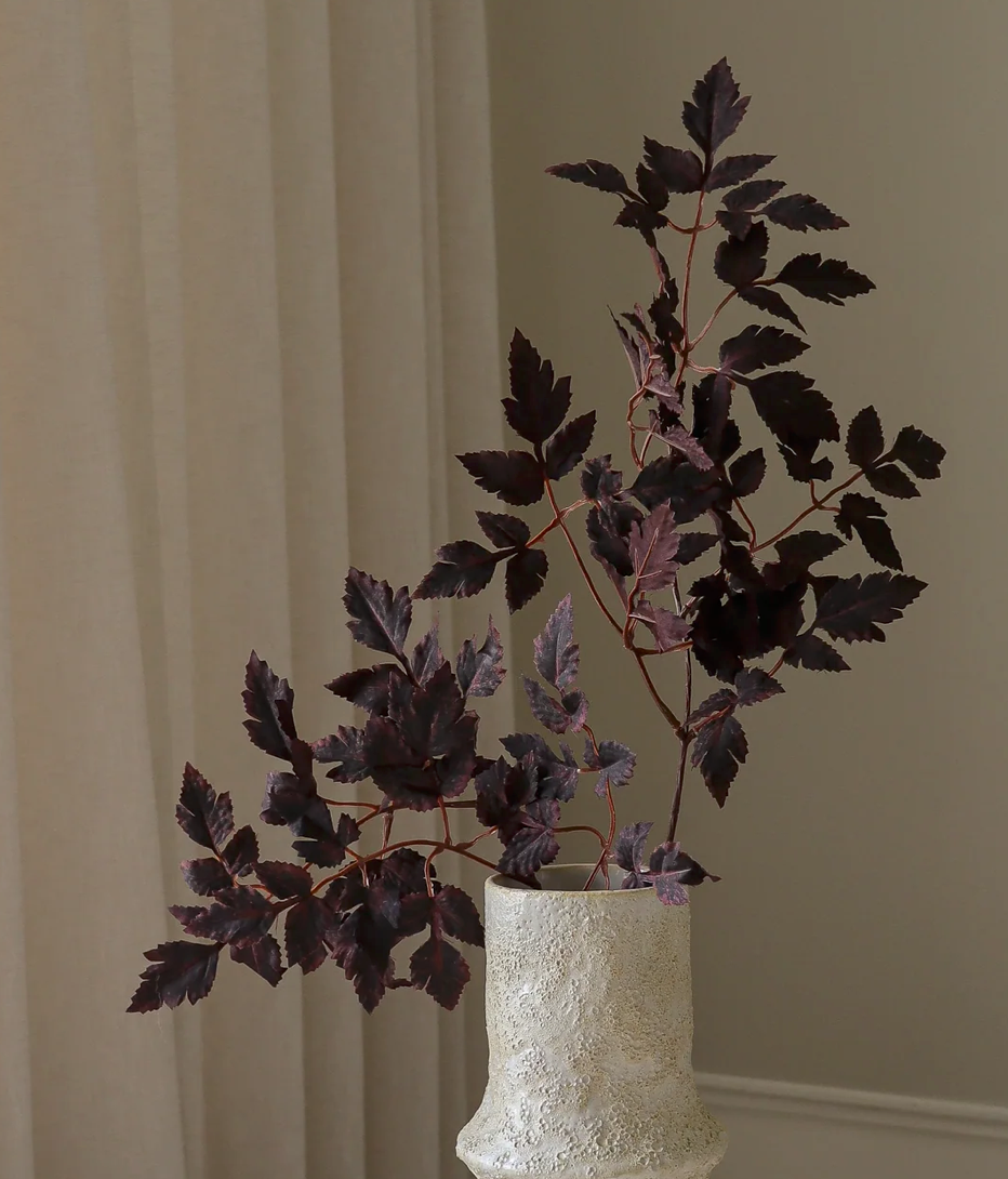 Plum bladeren tak